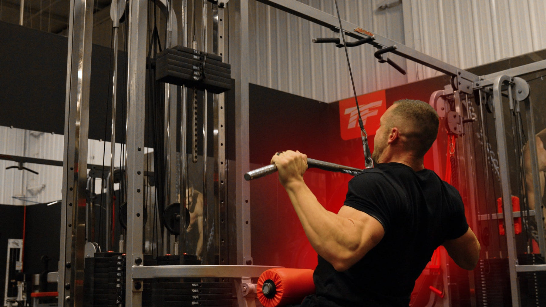 Athlete performing lat pulldown variations for back width