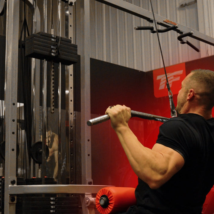Athlete performing lat pulldown variations for back width