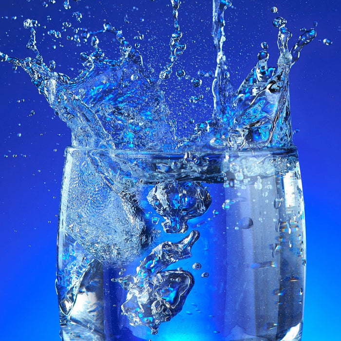 Glass of water for staying hydrated and curbing food cravings
