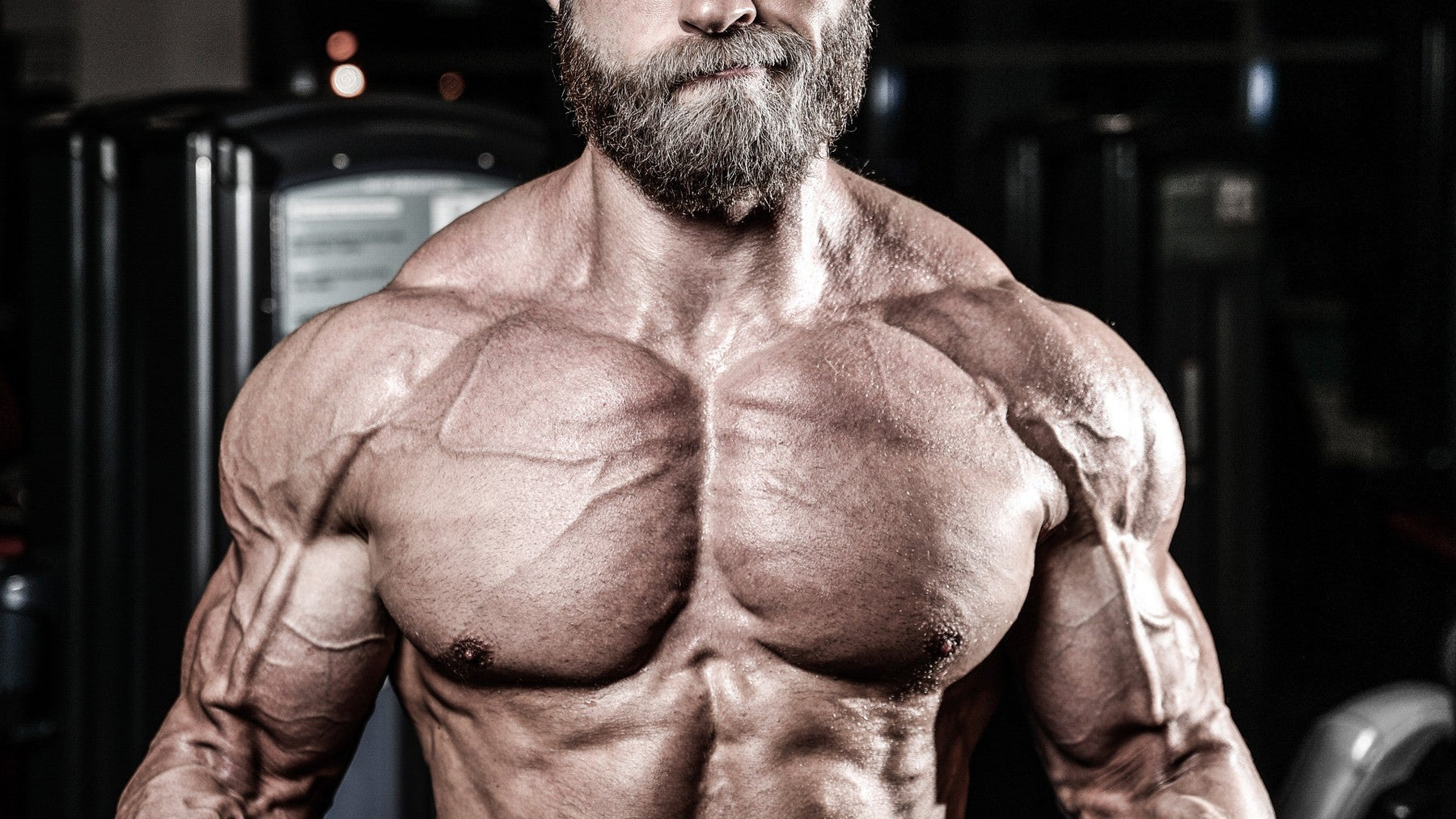 IFBB Pro bodybuilder benching to illustrate the role of genetics