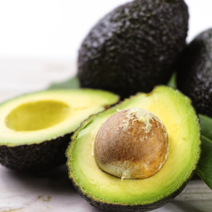 Sliced avocado showing its calorie count