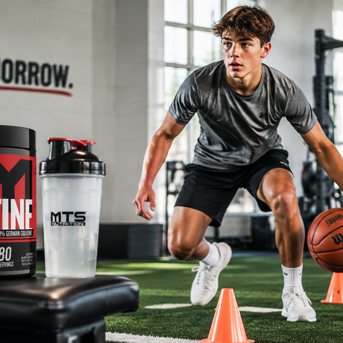 Teenage basketball athletes doing agility drills in a gym with MTS Creapure Creatine and a shaker bottle in the foreground.