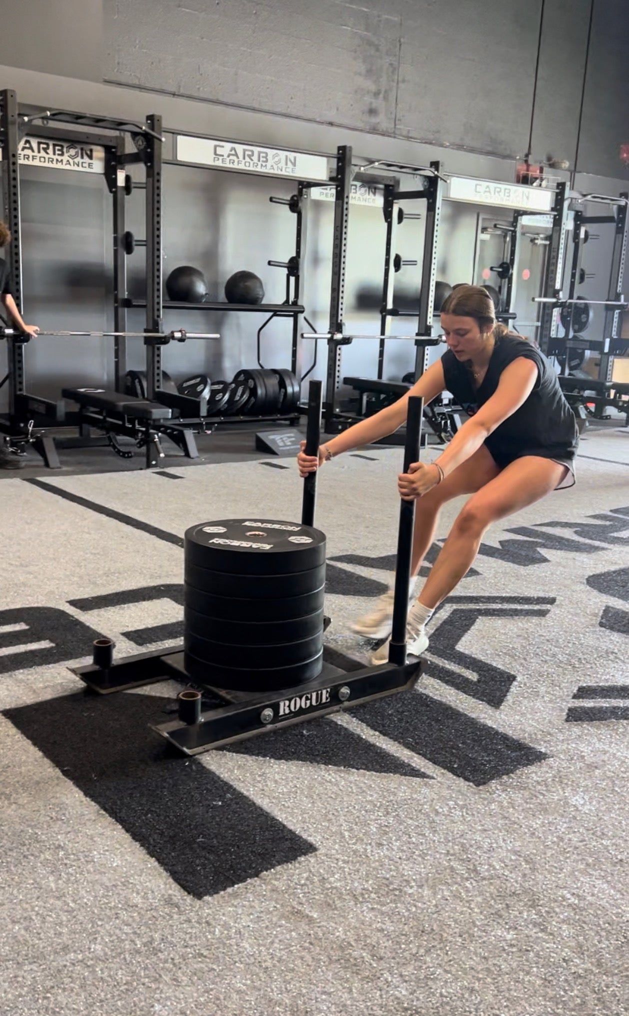 Athlete performing sled push and pull training