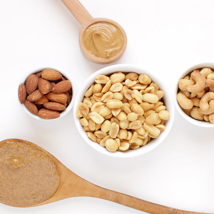 Assortment of nut butters showing protein and nutrition breakdown