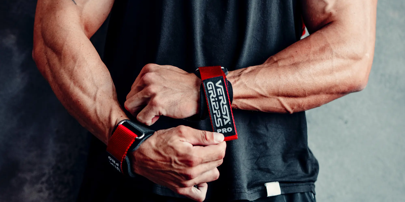 Athlete using Versa Gripps lifting straps during a workout
