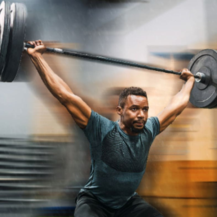 Group CrossFit training session in a gym