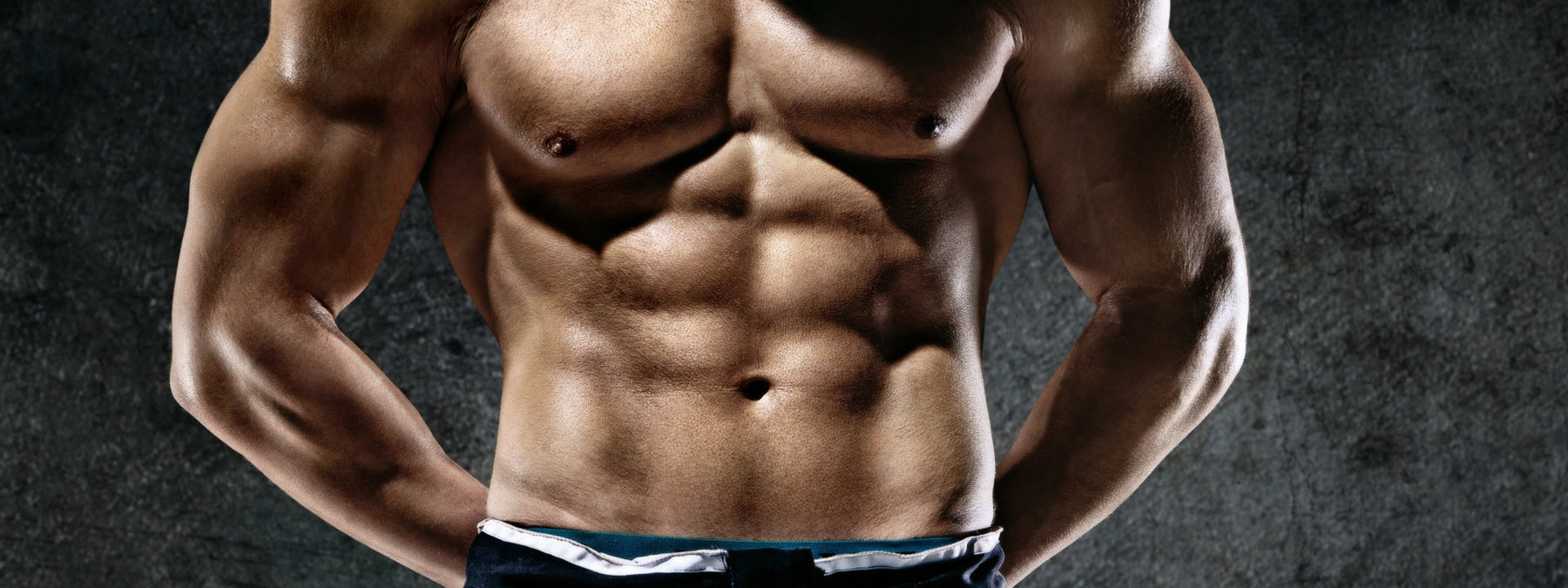 Defined abdominal muscles representing muscle mass gains