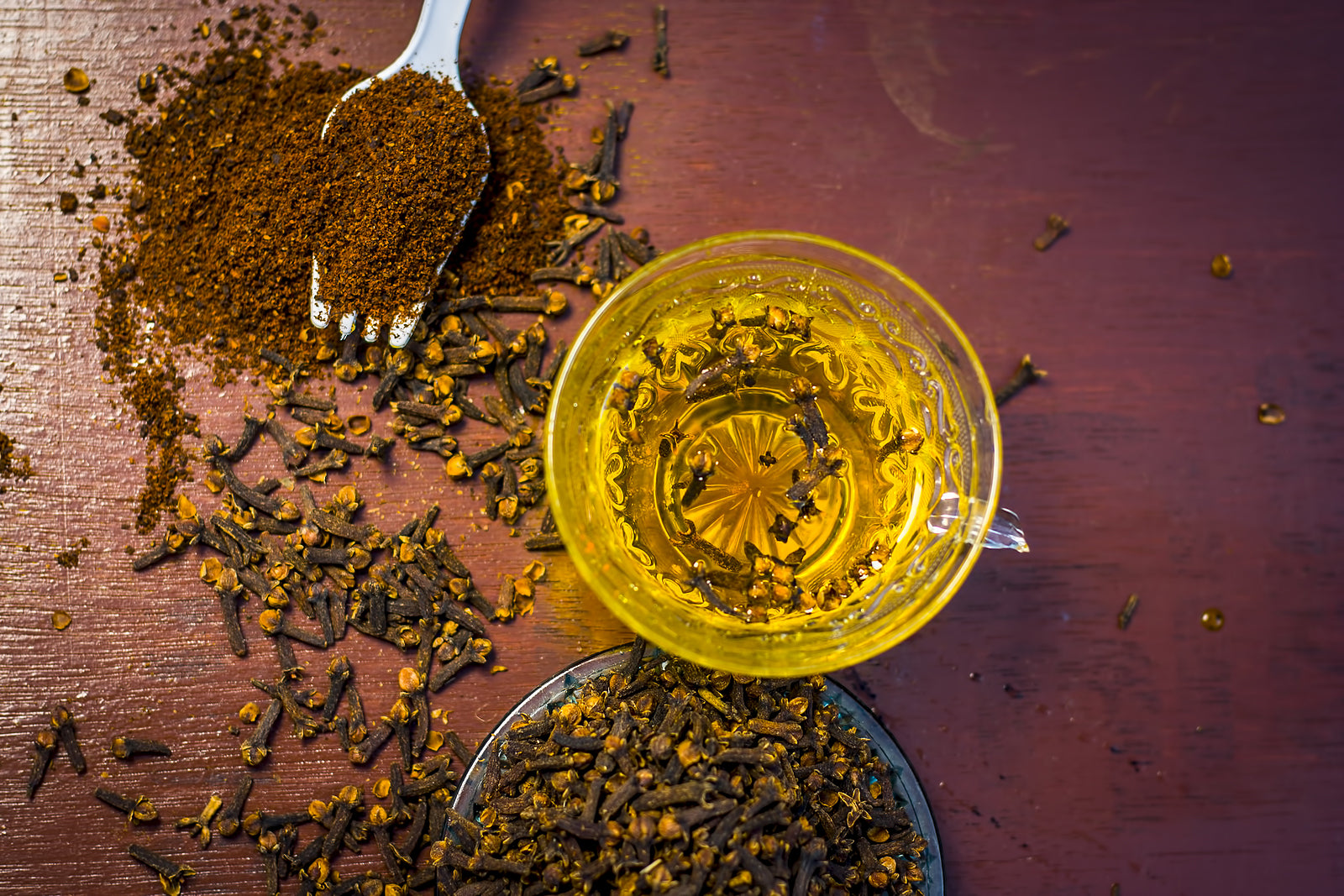 Glass of clove water on a table