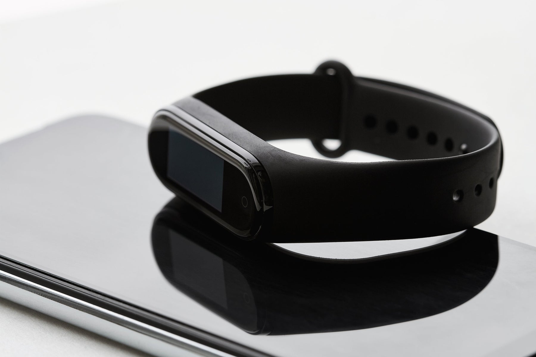 Black fitness tracker watch on a wrist