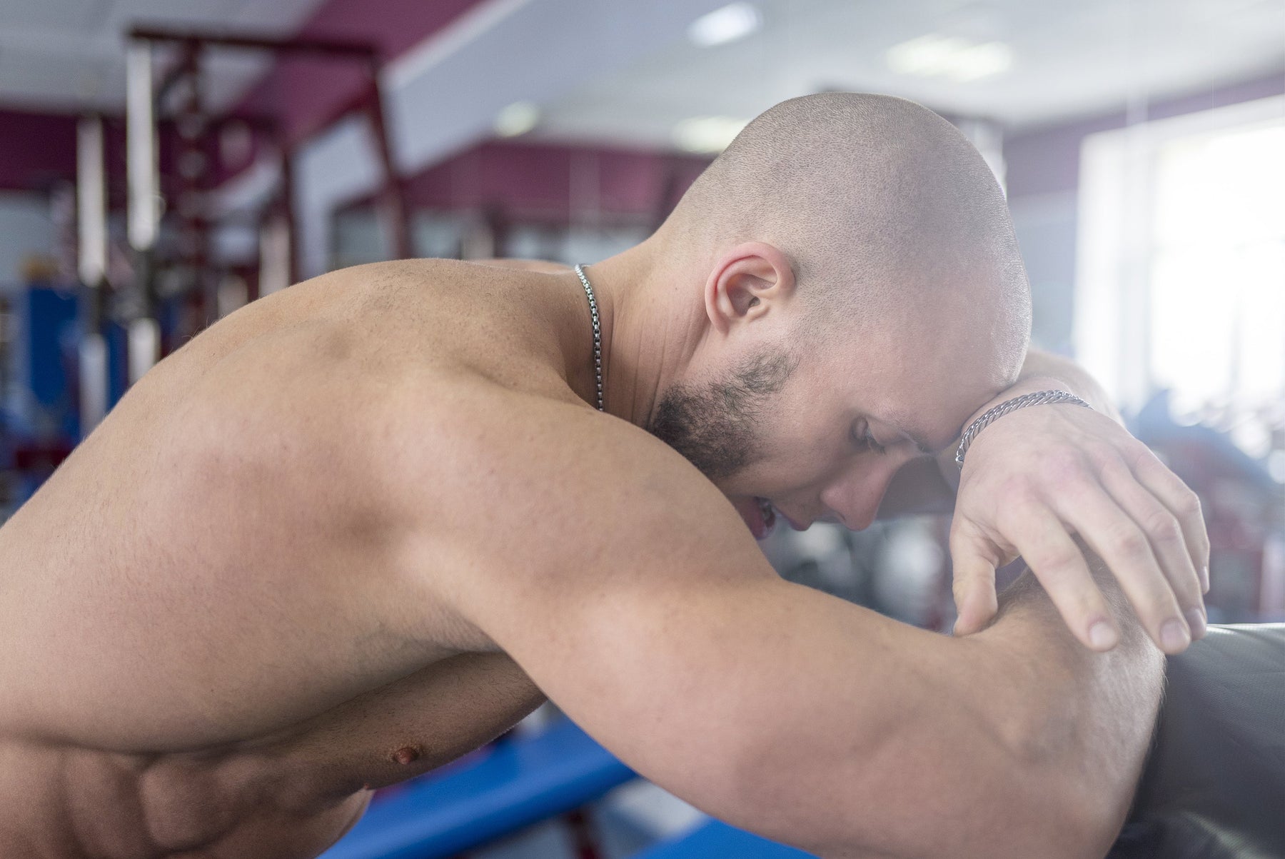 Bodybuilder resting after an intense workout