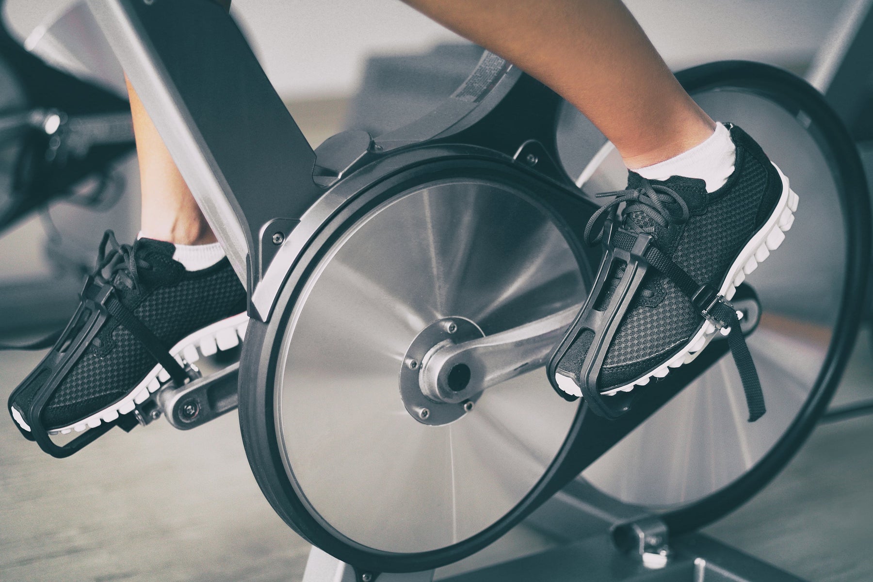 Person using a fitness machine at home during a thermogenic workout