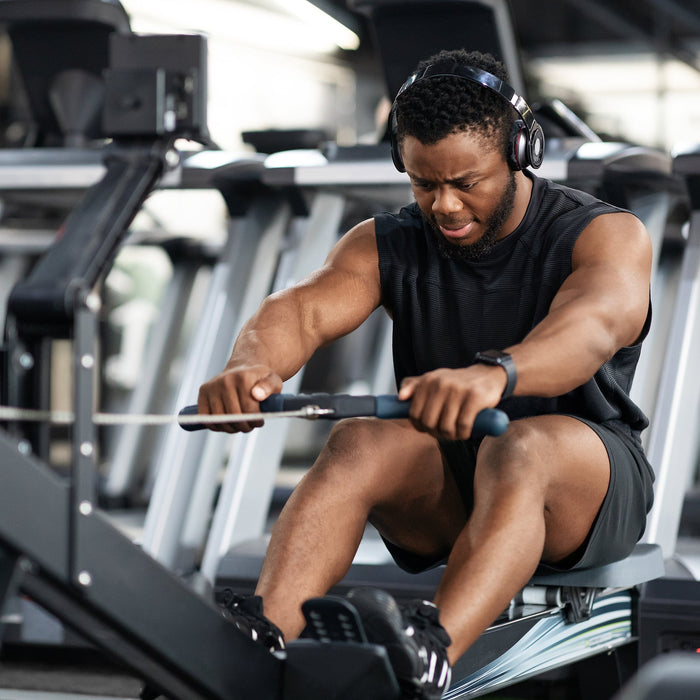 Athlete using a rowing machine for strength and endurance training