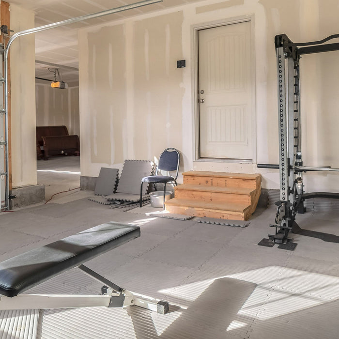 Home gym setup with a variety of exercise equipment