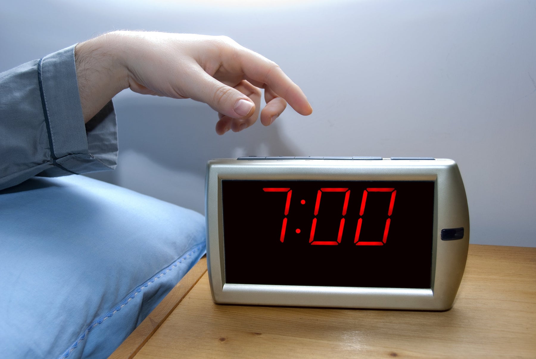Person waking up early to stick to health goals in the new year
