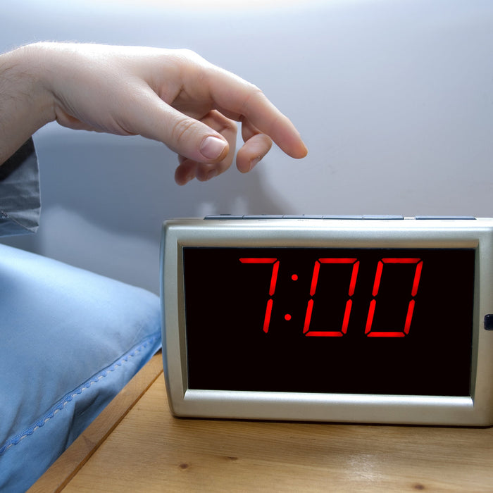 Person waking up early to stick to health goals in the new year