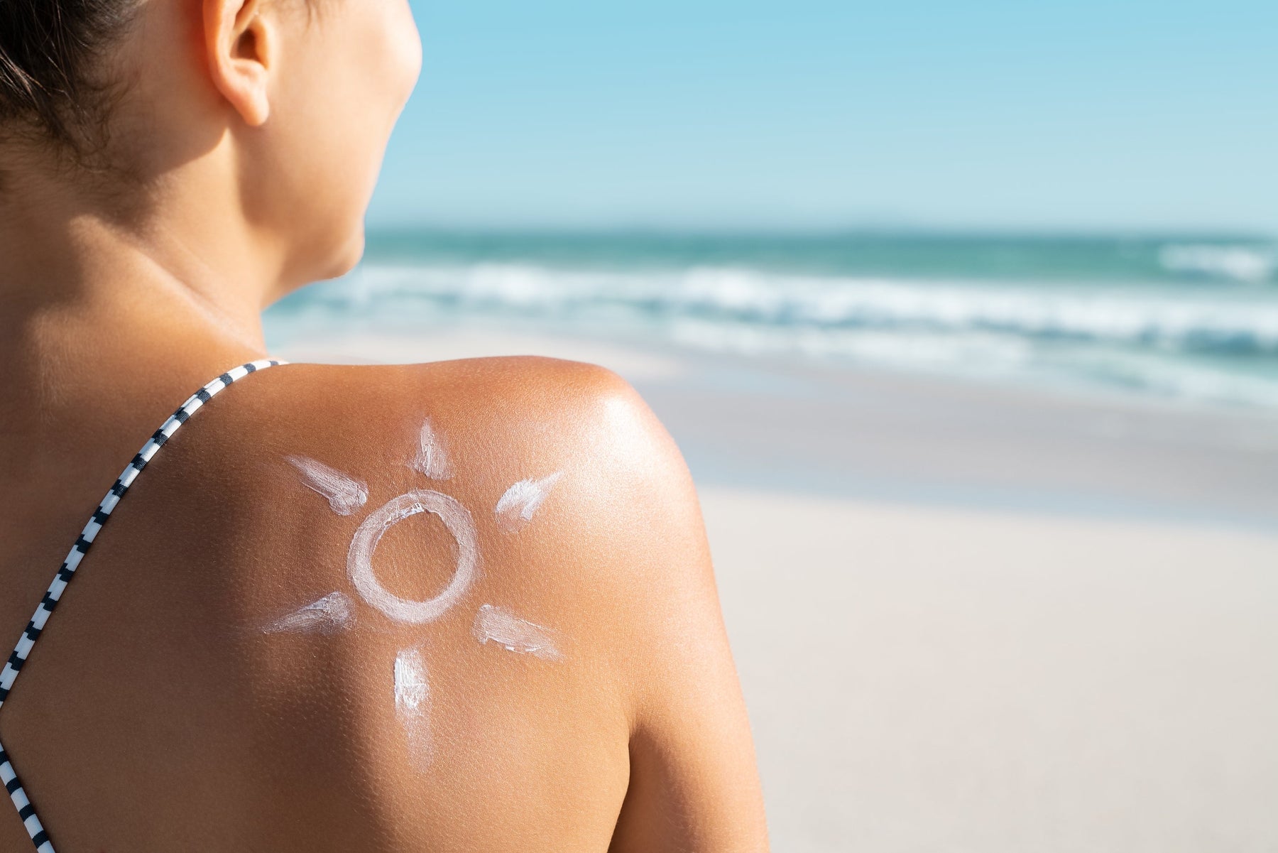 Woman enjoying summer sun exposure outdoors