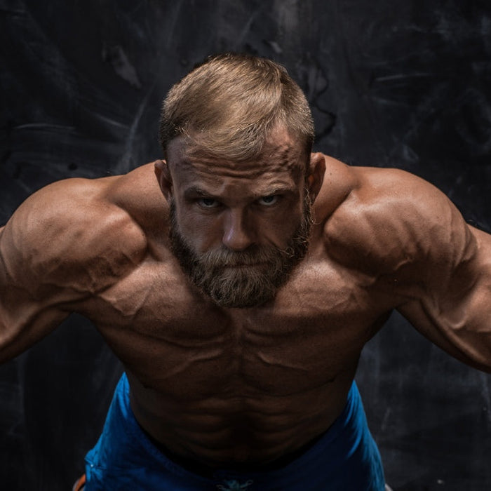 Athlete bulking illustrating mental toughness and physical strength