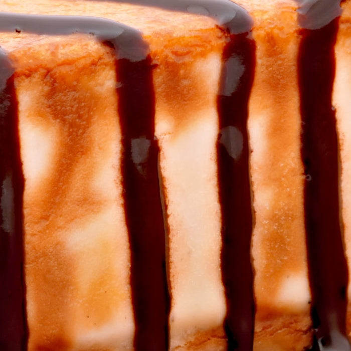 Slice of high protein caramel cake with chocolate cream cheese filling