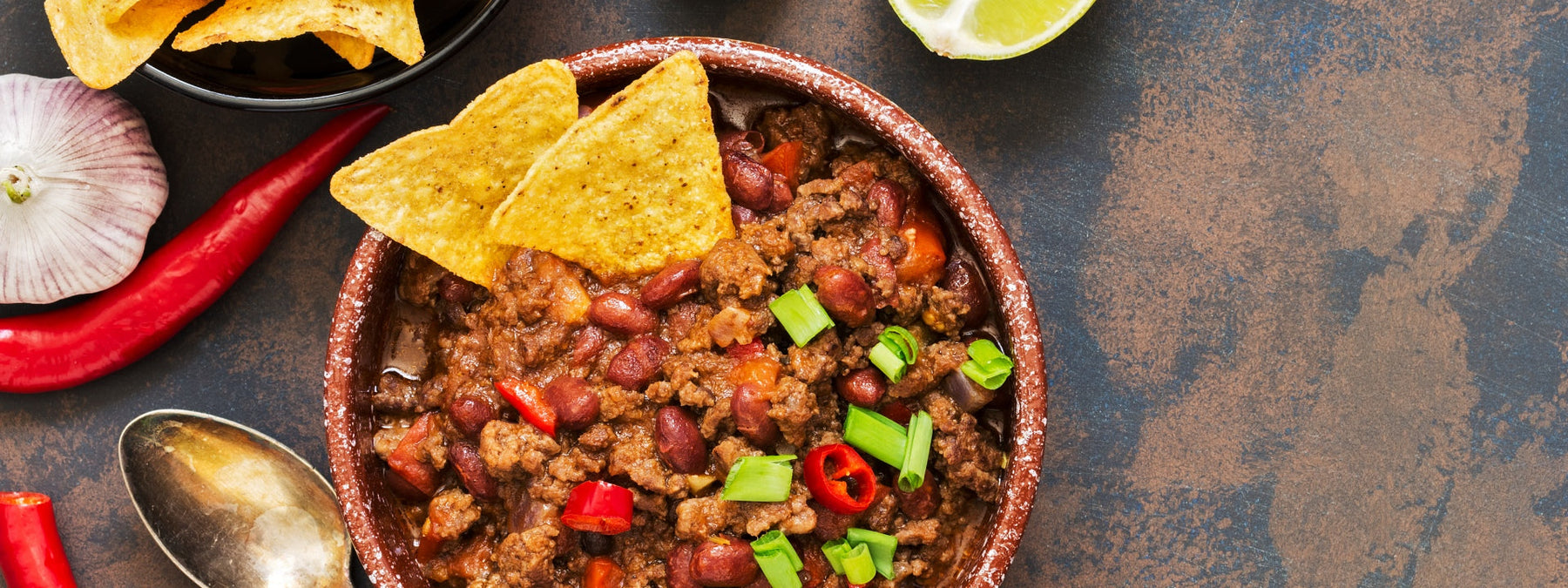 Bowl of shredded chicken chili made in a crockpot