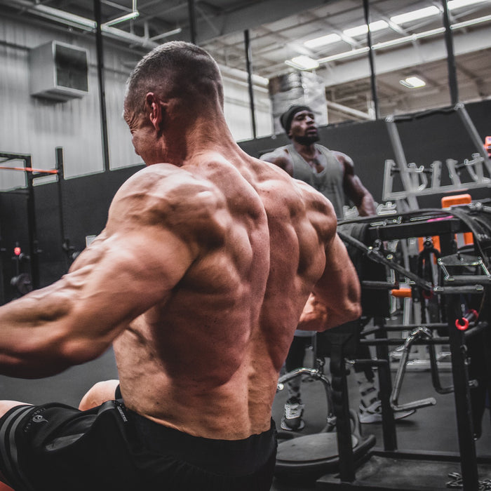 Marc Lobliner performing a wide grip lat pulldown, the anchor pull movement in this short four day push pull gym workout