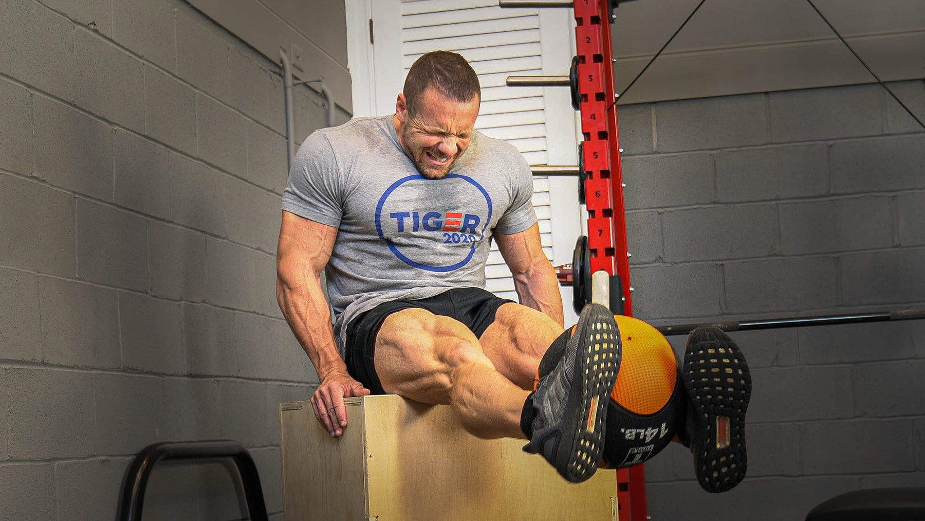 Athlete performing a medicine ball leg extension exercise