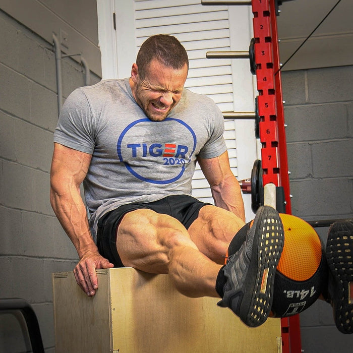 Athlete performing a medicine ball leg extension exercise