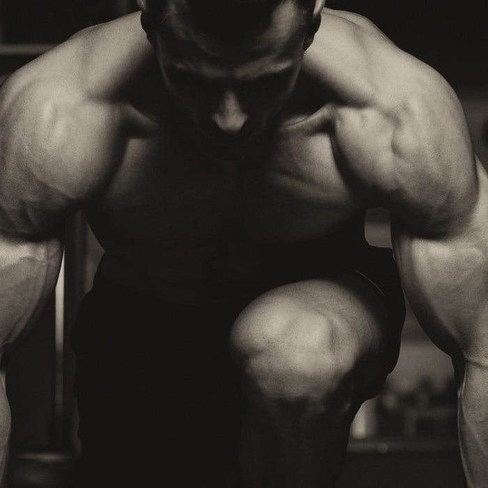 Bodybuilder demonstrating common muscle building training mistakes