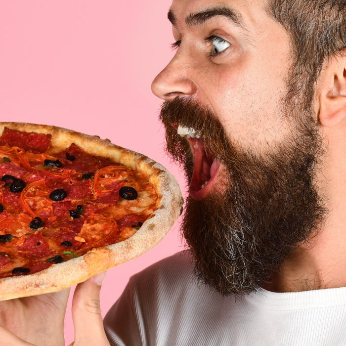Slice of pizza illustrating what a dirty bulk diet looks like