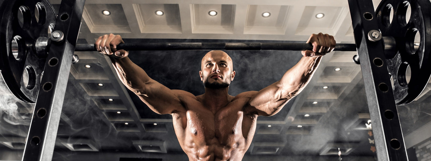 Weightlifter calculating one rep max percentages for training