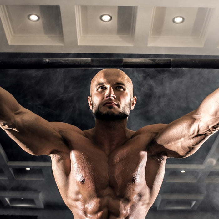 Weightlifter calculating one rep max percentages for training