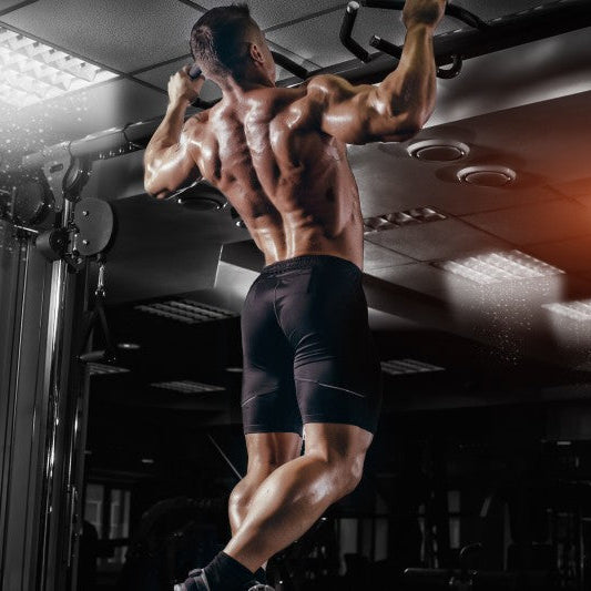 Athlete performing pull-ups as part of an EMOM workout