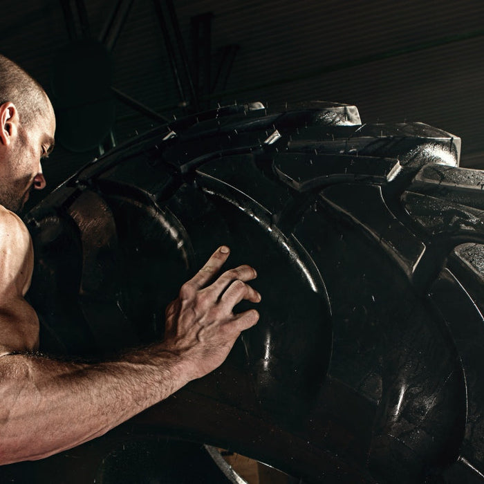 Athlete pulling a tire illustrating that talent is overrated