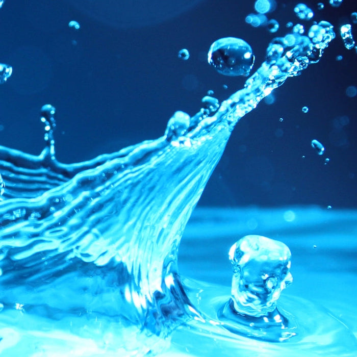 Glass of water representing daily water intake recommendations