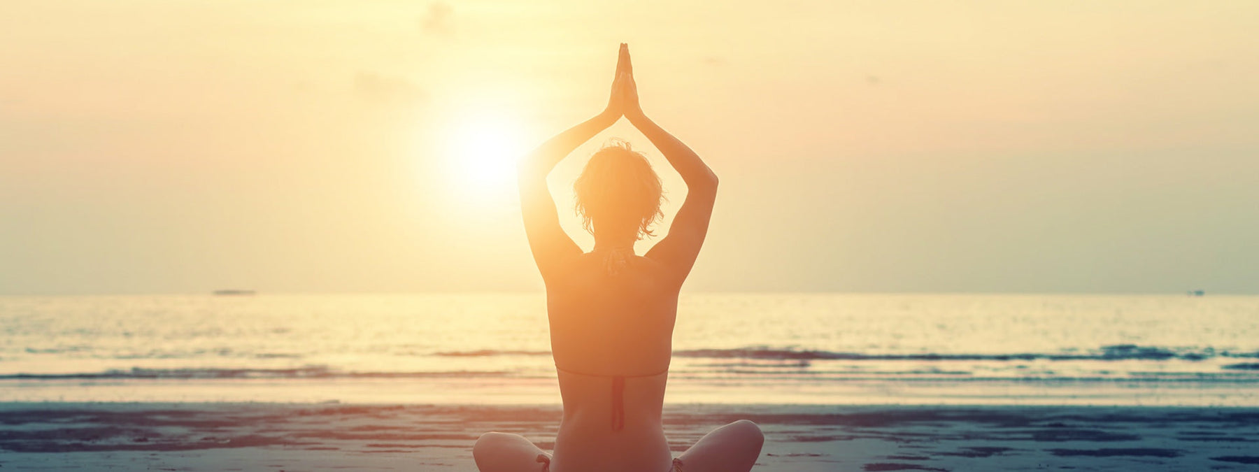 Person practicing yoga to stay centered