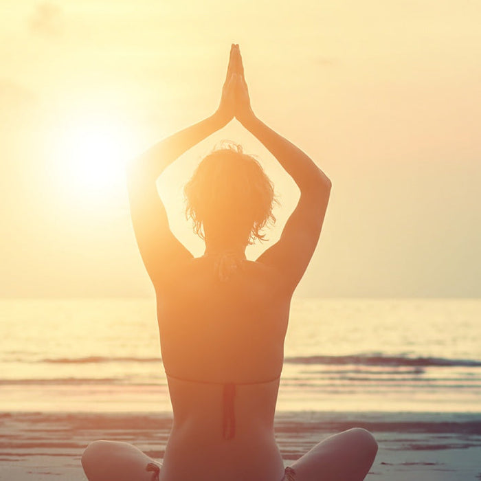 Person practicing yoga to stay centered
