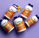 NOW Foods Rhodiola 500 mg capsules with multiple NOW supplement bottles arranged on purple background