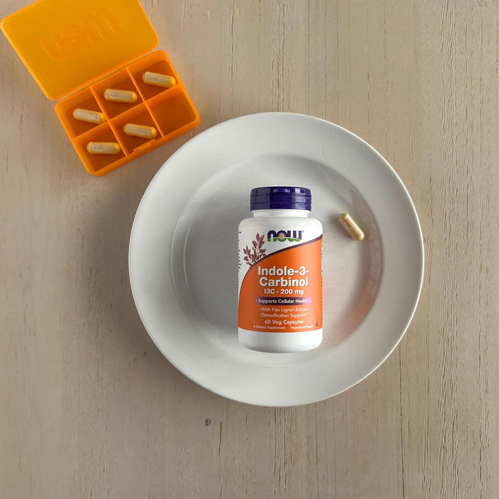 NOW Foods Indole-3-Carbinol 200 mg 60 veg capsules lifestyle image with bottle on plate