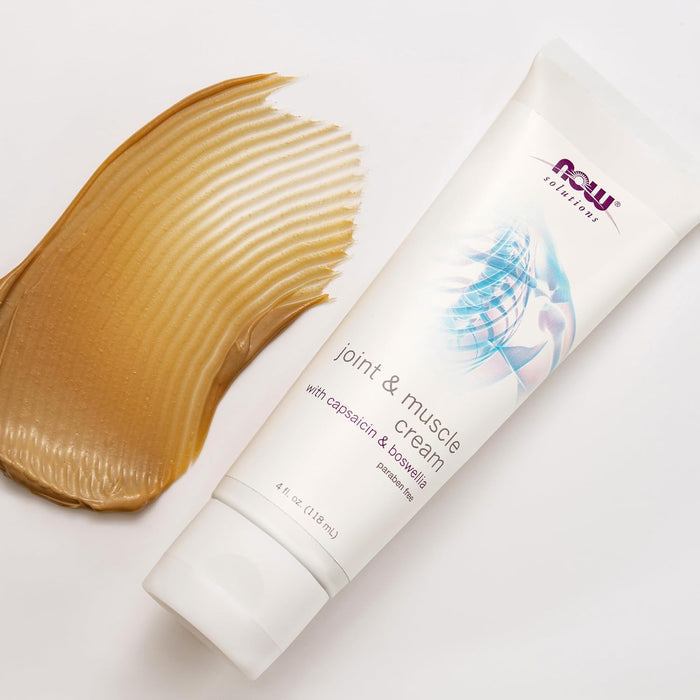 NOW Solutions Joint & Muscle Cream with capsaicin and boswellia 4 oz tube next to cream texture swipe