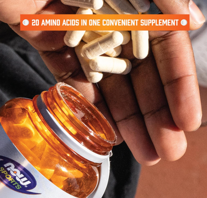 NOW Sports Amino Complete capsules in hand amino acid blend supplement 20 amino acids